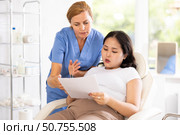 European doctor registering woman to cosmetology procedures. Стоковое фото, фотограф Яков Филимонов / Фотобанк Лори