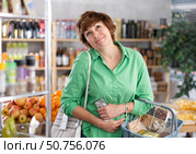 Middle-aged woman felt unwell and had abdominal pain while shopping. Buyer. Стоковое фото, фотограф Яков Филимонов / Фотобанк Лори