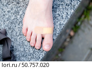 Beige plaster on a teenager's bare foot from a callus, close-up. Стоковое фото, фотограф Кашапова Эльвира / Фотобанк Лори