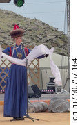 ELANTSY, IRKUTSK REGION, RUSSIA - July 5, 2025: Erdy Games – festival of nomadic peoples of Eurasia on coast of Baikal Lake. Vertical video of Buryat girl in national blue costume with hadak on open stage in Beauty Contest. Редакционное видео, видеограф Виктория Катьянова / Фотобанк Лори