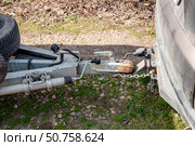 A car hitch is connected to a trailer whose spare tires are attached to the trailer frame. Стоковое фото, фотограф Коханова Наталья / Фотобанк Лори