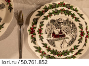 Christmas table setting with a plate, napkin and cutlery. Стоковое фото, фотограф Оксана Шведкова / Фотобанк Лори