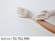 Female hands wearing disposable gloves. Стоковое фото, фотограф Акимова Надежда / Фотобанк Лори