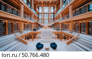 Grand Wooden Library Interior: A Modern Architectural Masterpiece of Bookshelves, Stairs, and Light. Стоковое AI-изображение, AI-художник Данила Большаков / Фотобанк Лори