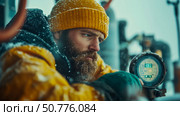 Bearded Man in Yellow Winter Gear Observing a Gauge in Snowy Conditions. Стоковое AI-изображение, AI-художник Данила Большаков / Фотобанк Лори