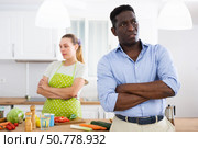 Portrait of man having quarrel with his wife in kitchen. Стоковое фото, фотограф Татьяна Яцевич / Фотобанк Лори