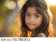 Portrait of adorable young girl posing outdoors at sunset with backlighting and bokeh effect. Стоковое AI-изображение, AI-художник Иван Рябоконь / Фотобанк Лори