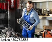 Man professional auto mechanic repairing car engine in garage. Стоковое фото, фотограф Яков Филимонов / Фотобанк Лори