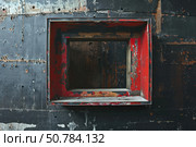 Old red window frame on black wall reclaimed by nature. Стоковое AI-изображение, AI-художник Иван Рябоконь / Фотобанк Лори