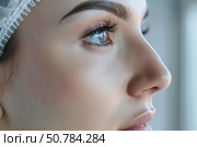 Young woman waiting for plastic surgery intervention. Стоковое AI-изображение, AI-художник Иван Рябоконь / Фотобанк Лори