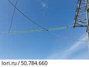 Insulators on power transmission line under clear blue sky. Стоковое фото, фотограф Михаил Пряхин / Фотобанк Лори