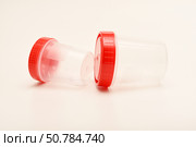 Jars for urine and fecal tests. Containers for medical tests. Стоковое фото, фотограф Valeriy Lushchikov / Фотобанк Лори