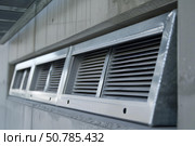 Row of industrial metal ventilation air ducts on a building. Стоковое AI-изображение, AI-художник Иван Рябоконь / Фотобанк Лори