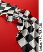 Checkerboard Pattern on a Red Background Used in Game or Design Settings for Visual Appeal. Стоковое AI-изображение, AI-художник Юлия Гапеенко / Фотобанк Лори