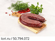 Delicious dry cured beef basturma on table, closeup. Стоковое фото, фотограф Андрей Старостин / Фотобанк Лори