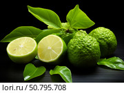 Fresh bergamot and limes resting on dark wooden surface with leaves. Стоковое AI-изображение, AI-художник Иван Рябоконь / Фотобанк Лори