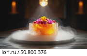 A gourmet dessert elegantly presented with floral garnish and a captivating smoke effect. Стоковое AI-видео, аниматор Лариса Пономарева / Фотобанк Лори