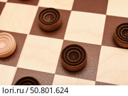 Wooden checkers on the board. The board game checkers. Стоковое фото, фотограф Valeriy Lushchikov / Фотобанк Лори