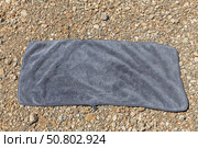 A gray towel on the orange and yellow stones background. Стоковое фото, фотограф Татьяна Куклина / Фотобанк Лори