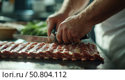 Chef skillfully prepares meat for a delicious meal in a modern kitchen during the afternoon hours. Стоковое AI-изображение, AI-художник Сергей Толмачёв / Фотобанк Лори