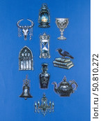 Novosibirsk, Russia - May 30, 2025: Vinyl stickers featuring mystical and enchanting witch-inspired designs in a dark, elegant style. These stickers depict cauldrons, spellbooks, crescent moons, pentagrams, magical symbols, and mysterious figures adorned with robes and hats. Редакционное фото, фотограф Виталий Сова / Фотобанк Лори