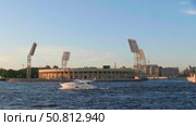 17.07.2025. Saint Petersburg, Russia. Boat sails past Petrovsky Stadium in Saint Petersburg during a clear day backdrop. Стоковое видео, видеограф Игорь Гарцевич / Фотобанк Лори