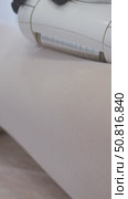 In clinic, cosmetologist employs vacuum roller device with manipulator to administer an anti-cellulite massage to client's thighs. Стоковое видео, видеограф Strunov David / Фотобанк Лори