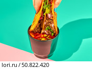 Traditional mexican birria ramen consomme soup and tacos with braised beef. Dip tacos in broth. Стоковое фото, фотограф Ирина Буракова / Фотобанк Лори