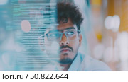 Indian male software developer focused on futuristic coding and technology. Стоковое AI-видео, аниматор Анастасия Золотницкая / Фотобанк Лори
