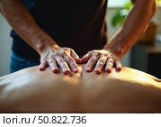 Руки мужчины-врача лежат на спине пациента. The doctor's hands are on the patient's back. Стоковое AI-изображение, AI-художник Смирнова Светлана / Фотобанк Лори