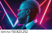 Man in Suit Contemplating the Neon Future. Стоковое AI-видео, аниматор Данила Большаков / Фотобанк Лори