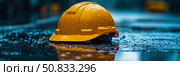 Safety first concept: Yellow hardhat in the rain reflecting on a puddle, symbolizing workplace safety and resilience during adverse weather conditions. Стоковое AI-изображение, AI-художник Данила Большаков / Фотобанк Лори