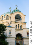 Yevpatoria, Russian Federation - July 05, 2025: Beautiful architectural details of a church with blue domes and crosses, showcasing intricate design and religious significance in a serene setting. Редакционное фото, фотограф Ирина Ручушкина / Фотобанк Лори