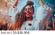 New Year's Eve bash: A beautiful girl rejoices in the confetti shower with friends, a joyous party moment. Стоковое AI-изображение, AI-художник Данила Большаков / Фотобанк Лори