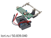 Цифровой мультиметр на белом фоне. Digital  multimeter on a white background. Стоковое фото, фотограф Татьяна Д / Фотобанк Лори