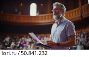 Academic Presentation: Grey Haired Man Lecturing to an Audience in a Classic Auditorium Setting. Стоковое AI-изображение, AI-художник Данила Большаков / Фотобанк Лори