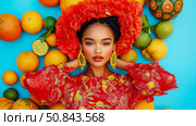 Fruitful Beauty: A portrait of a woman adorned in flowers and citrus, radiating vibrancy and the essence of summer. Стоковое AI-изображение, AI-художник Данила Большаков / Фотобанк Лори