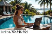 A woman is sitting at a table by a pool, typing on a laptop. Стоковое AI-изображение, AI-художник Ярославский Максим / Фотобанк Лори