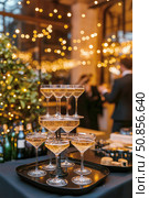 Celebrate With Sparkling Wine and Festive Treats During Winter Gatherings in a Cozy Setting. Стоковое AI-изображение, AI-художник Юлия Гапеенко / Фотобанк Лори