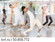 Young guy practicing breakdance in training hall. Стоковое фото, фотограф Яков Филимонов / Фотобанк Лори