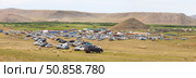 ELANTSY VILLAGE, IRKUTSK REGION, RUSSIA - July 5, 2025: Erdynskie Games – festival of nomadic peoples of Eurasia. Panoramic view of sacred Erd mountain and territory of festive site on summer day. Редакционное фото, фотограф Виктория Катьянова / Фотобанк Лори