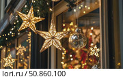 City streets advent Christmas decorations by night. Festive Xmas decor, colorful ornaments in urban setting. Holiday decorations of building or shops glow brightly, shiny stars. Illuminated ornaments. Стоковое AI-видео, аниматор Марина Демидюк / Фотобанк Лори