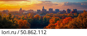Autumn Cityscape: A golden sunset illuminates urban buildings rising beyond a forest of colorful fall trees, perfect for scenic prints. Стоковое AI-изображение, AI-художник Данила Большаков / Фотобанк Лори