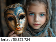Portrait of a girl with bright blue eyes and freckles, holding an antique theater mask with gold plating next to her face. Her gaze is calm and deep, and her face is half hidden by a light scarf. The atmosphere of the image combines mystery, symbolism and artistic expressiveness. Ideal for themes related to identity, theater, secrets, childhood and art. Стоковое AI-изображение, AI-художник Анна Кривицкая / Фотобанк Лори