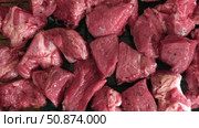 Raw sliced pork in sauce. Pieces of fresh marinated pork medallions. Freshly meat tenderloin, perfect for culinary, home cooked meals and flavor. Chopped Pork ham fillet with spice, herbs. 4K video. Стоковое видео, видеограф Марина Демидюк / Фотобанк Лори