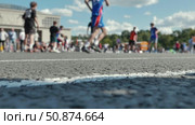 Athletes playing basketball during sports day, focusing on the ground. Стоковое видео, видеограф Mikhail Davidovich / Фотобанк Лори