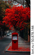Concept: Epistolary love; a red letterbox beneath a crimson canopy on the street. Стоковое AI-изображение, AI-художник Данила Большаков / Фотобанк Лори