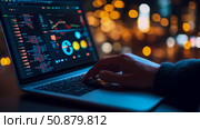 Nightly coding session: Programmer's hand on laptop displaying intricate data and charts, illuminated by bokeh. Стоковое AI-изображение, AI-художник Данила Большаков / Фотобанк Лори