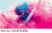 Warrior's Resolve: An Ancient Knight Contemplates Battle, Fading into a Cloud of Colorful Dust. Стоковое AI-изображение, AI-художник Данила Большаков / Фотобанк Лори