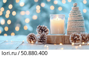 Winter Solstice Serenity: Candlelight, Knit Tree, and Pinecone Charm for Seasonal Decor. Стоковое AI-изображение, AI-художник Данила Большаков / Фотобанк Лори